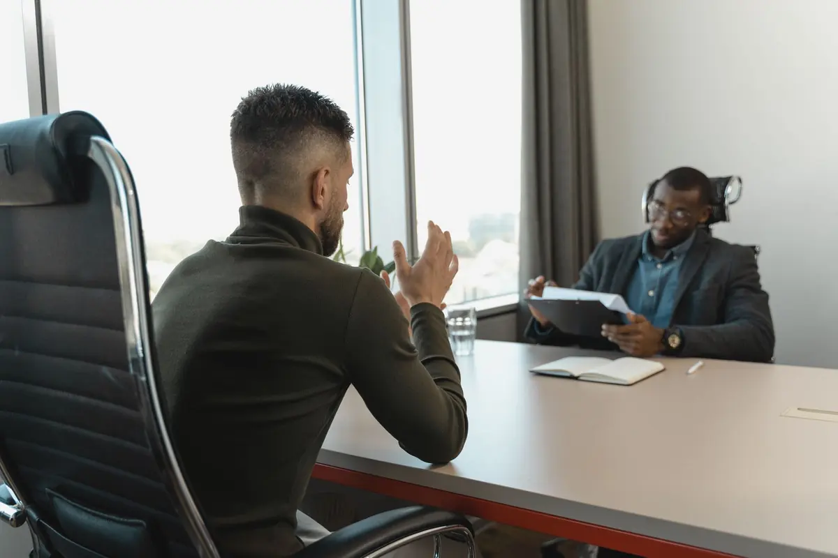 Interviewer listening to a candidate introduce themselves